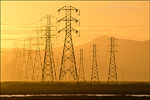 Photo: High Tension electrical power transmission towers and wires at sunrise, San Pablo Bbay National Wildlife Refuge, California