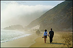 Photo: Couple walking together on sand in fog at Pfeiffer Beach, Big Sur Coast, Monterey County, California