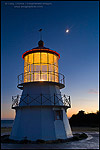Photo: Crescent Moon over owl on the Cape Mendocino Lighthouse in evening light, Shelter Cove, Lost Coast, Humboldt County, California
