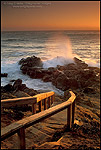 Photo: Wooden stairs leading down ocean wave crashing on coastal rocks at sunset, Leffingwell Landing, Cambria, California