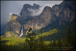Photo: Sunlight and storm clouds over Bridalveil Fall waterfall and forest, Yosemite Valley, Yosemite National Park, California