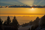 Photo: Sunset and god beams from the rim of Crater Lake, Crater Lake National Park, Oregon