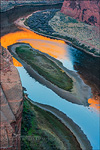 Photo: Morning light on sandstone cliffs reflected in the Colorado River at Horseshoe Bend, near Page, Arizona