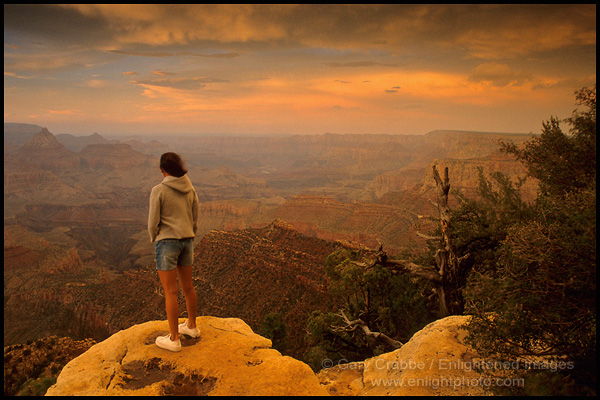 Photo: Young female tourists standing on the rim edge watching a sunset from Granview Point, South Rim, Grand Canyon National Park, Arizona