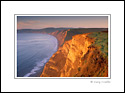 Morning light on steep coastal cliffs at Drakes Bay, Point Reyes National Seashore, Marin County Coast, California
