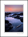 Coastal rocks and waves in tidal zone at sunset, Fitzgerald Marine Reserve, near Montara, San Mateo County Coast, California