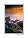 Ocean waves breaking on coastal rocks at sunset, Bodega Head, Sonoma Coast, California