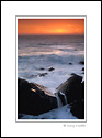 Waterfall in surf at sunset on the rocky Sonoma Coast, near Fort Ross, California