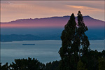 picture: Beam of red sunlight and Mount Tamalpais at sunset over San Francisco Bay, from the Berkeley Hills, California