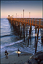 Picture: Surfers checking out the waves, next to the Oceanside Pier, California