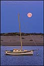 Photo: Full moon setting at dawn over sailboat, Morro Bay, California