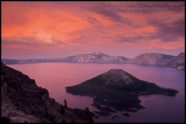 Picture: Alpenglow on storm clouds at sunset over Wizard Island and Crater Lake, Crater Lake National Park, Oregon