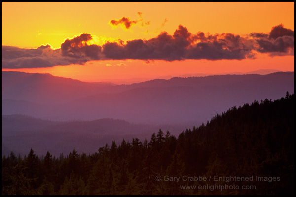 Photo: Sunset and clouds over forest and distant hills, Crater Lake National Park, Oregon