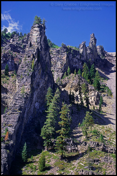 Photo: Steep rugged jagged rocky volcanic crater wall, Crater Lake National Park, Oregon