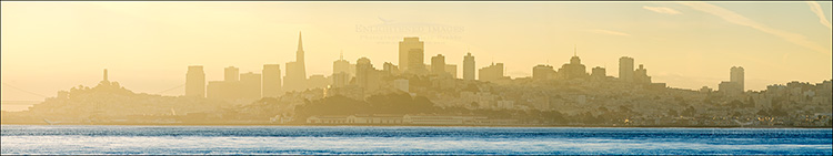 Panoramic Photo: San Francisco city skyline at sunrise rising above San Francicso Bay, California