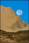 Picture Full moon setting over a rock outcrop near Tioga Pass, Yosemite National Park, California