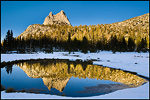 Picture: Sunset light on Cathedral Peak reflected in alpine tarn, Yosemite National Park, California