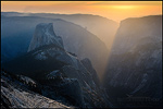 Picture: Sunset light streaming through Yosemite Valley toward Half Dome, as seen from atop Clouds Rest, Yosemite National Park, Califronia