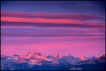 Picture: Alpenglow at sunset on clouds above the Sierra crest from atop Sentinel Dome, Yosemite National Park, California