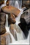 Picture: Detail close-up of water flowing off rocks in Cascade Creek during spring runoff, Yosemite National Park, California
