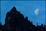 Picture:  Waning gibbous moon setting over rock spire, Yosemite National Park, California