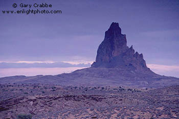 Stormy evening over Agathla Peak, rising out of the desert near Monument Valley, Arizona