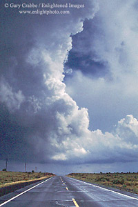 Thunderstorm cloud over highway on the Coconino Plateau, Arizona