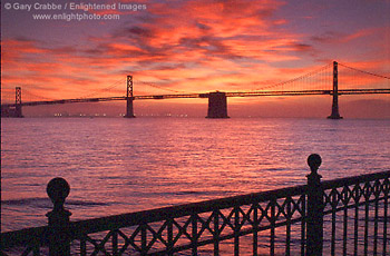 Sunrise over the San Francisco - Oakland Bay Bridge from, the Embarcadero, San Francisco, California