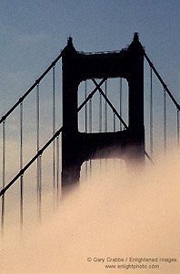 Fog and Golden Gate Bridge at sunrise, from the Marin Headlands, California