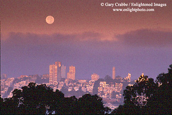Moonset at dawn into fog over Russian Hill, San Francisco, California