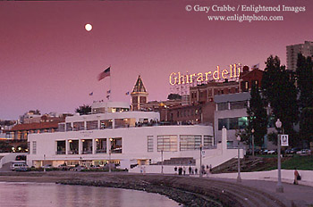 evening moonrise over the Maritime Museum and Ghiradelli Square, San Francisco, California