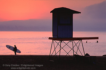Surfer at sunrise at Capitola Beach, Santa Cruz County, California