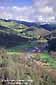 Stream runs through a valley below green hills in spring, east side of Mount Hamilton, Santa Clara County, California
