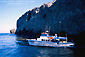 Photo: Island Packers boat in cove below cliff of East Anacapa Island, Channel Islands National Park, Southern California Coast