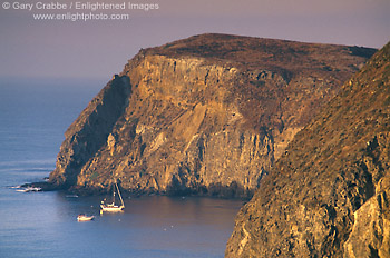 Photo: Sailboat anchored below sheer cliffs of Anacapa Island, Channel Islands National Park, Southern California Coast