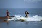Tandem Surfers riding surfboard on waves at Surfrider Beach State Park, Malibu, Los Angeles County, California