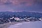 Overlooking waterfront town and sandy coast shore in evening light at Laguna Beach, California