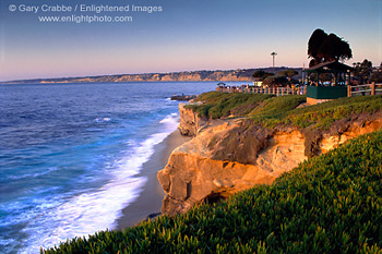 Ocean waves crashing on beach at sunset at Scripps Park, La Jolla, San Diego County Coast, California