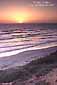 Sunset over the Pacific Ocean and the beach at Carlsbad, San Diego County, California