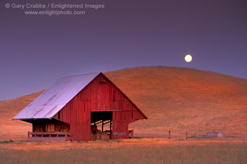 Evening moonrise over barn in the Tassajara Region, Contra Costa County, California