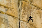 Rock climber climbing at Hidden Valley, Joshua Tree National Park, California