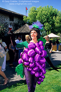 Woman wearing wine grape costume at A Taste of Yountville celebation, Napa Valley, California