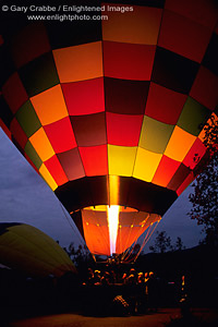 Flame fills Hot Air Balloon in pre-dawn light prior to tourist flight, Yountville, Napa Valley, California