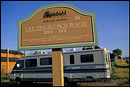 Photo: Old Stage Coach route marker sign and modern RV Coach, Santa Ynez, Santa Barbara County, California