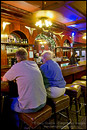 Photo: Customers sitting at antique wooden bar, Far Western Tavern, Guadalupe, California