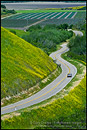 Photo: Country road curves through green hills and agriculture valley is Spring, near Lompoc, Santa Barbara County, California