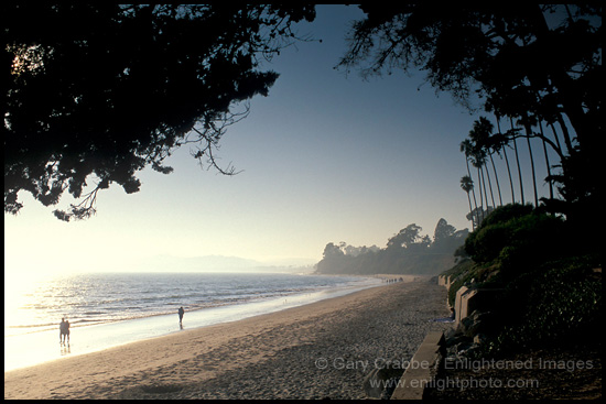 People walking on sand at Butterfly Beach, Santa Barbara, California