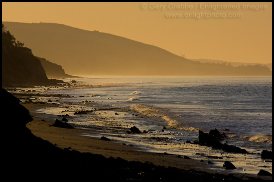 Golden sunrise light over coastal hills and beach at Gaviota Beach State Park, near Santa Barbara, California