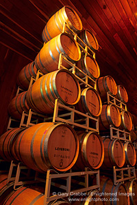Wooden wine barrels stacked in wine celler at Lambert Bridge Winery, Sonoma County, California