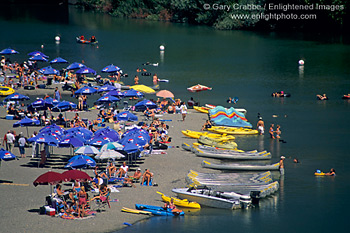 Summer crowds on sand at Johnsons Beach on the Russian River, Guerneville, Sonoma County, California